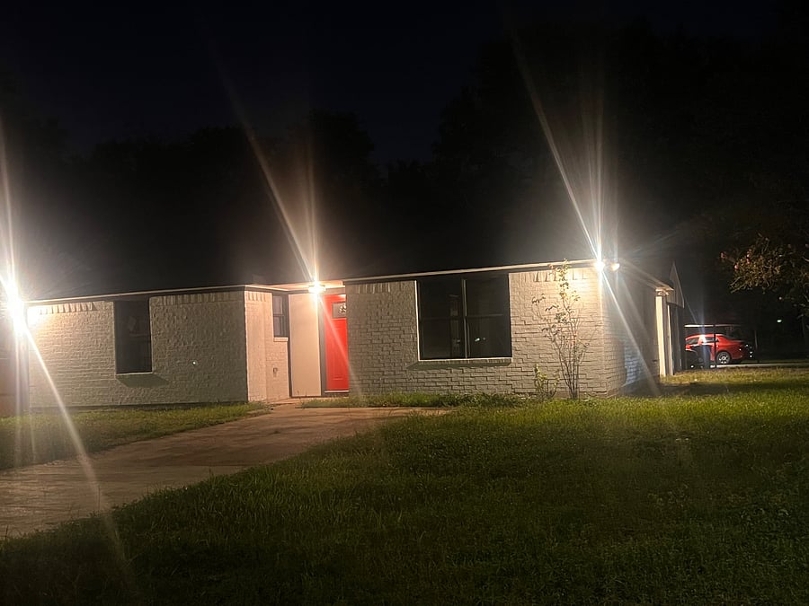 Our property is equipped with Ring cameras monitoring the exterior 24/7 for your safety and peace of mind. As shown in the image, bright exterior lighting enhances visibility and deters unwanted activity throughout the night.