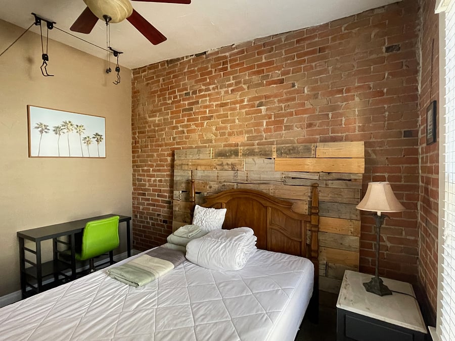 Master bedroom with available computer desk and bike storage pulley