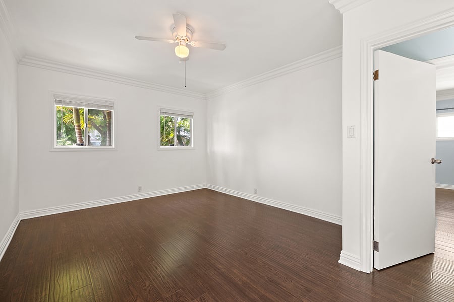 Master bedroom with windows to front of house