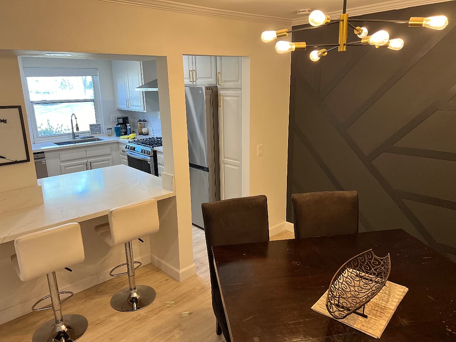 Dining area with breakfast bar and stunning accent wall