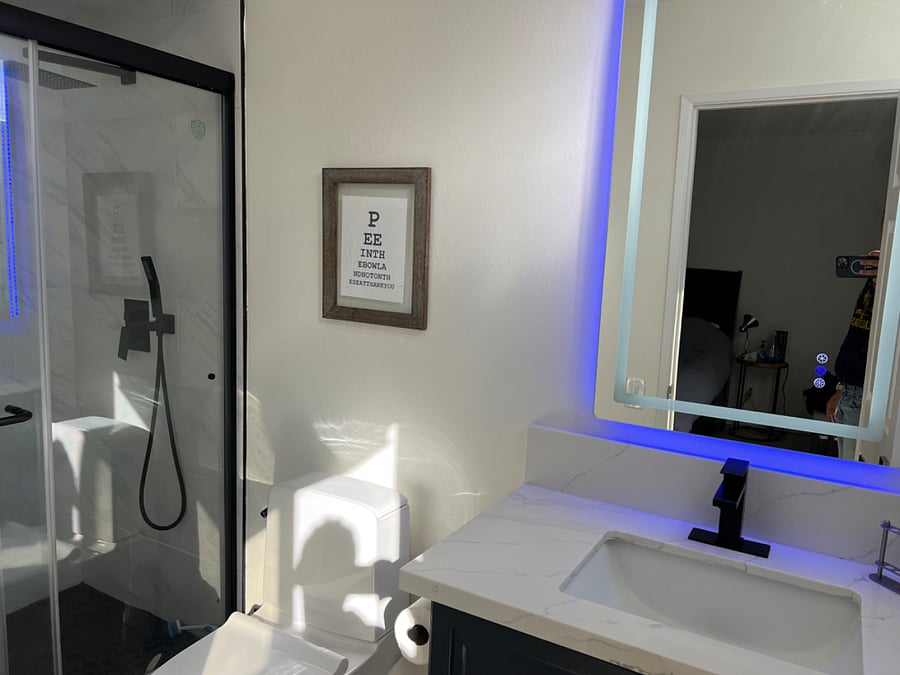 Ensuite bathroom with modern LED heated vanity mirror