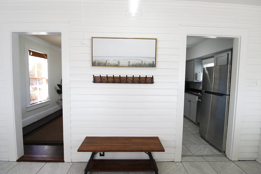 Entryway with storage. Leads to the dining room and kitchen.