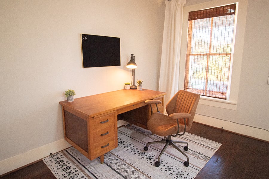 Solid wood desk and office swivel chair.