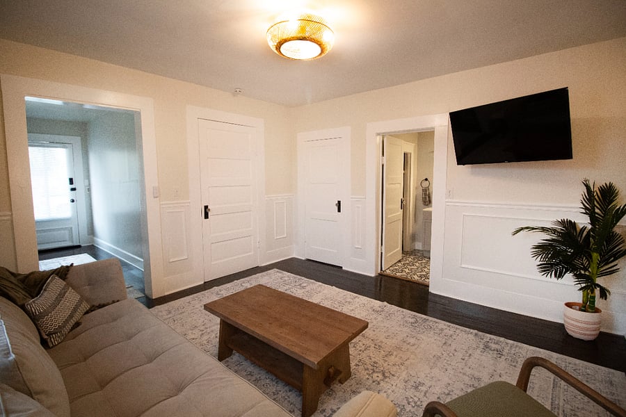 Living room leading to entryway bedroom, bathroom and closet