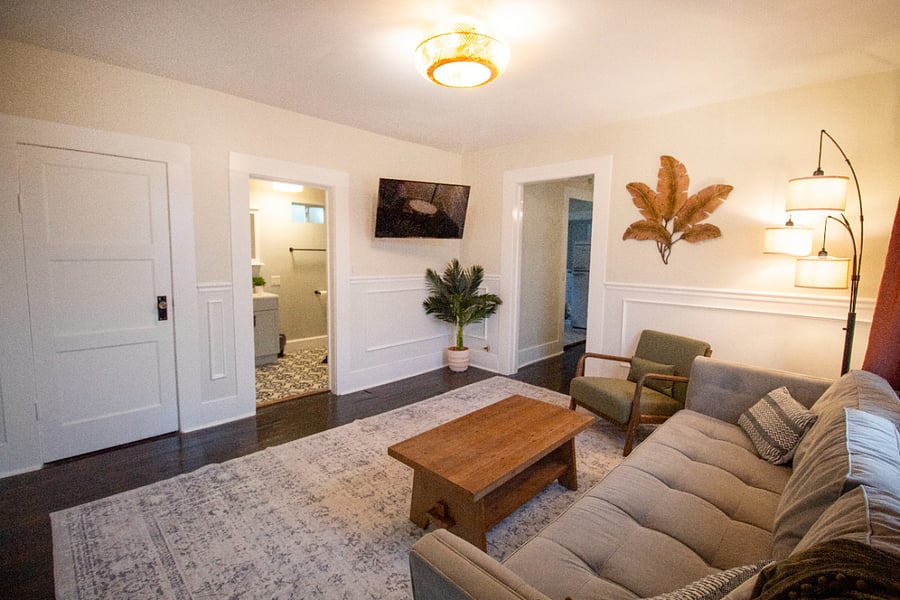 Living room leading to bathroom and dining room