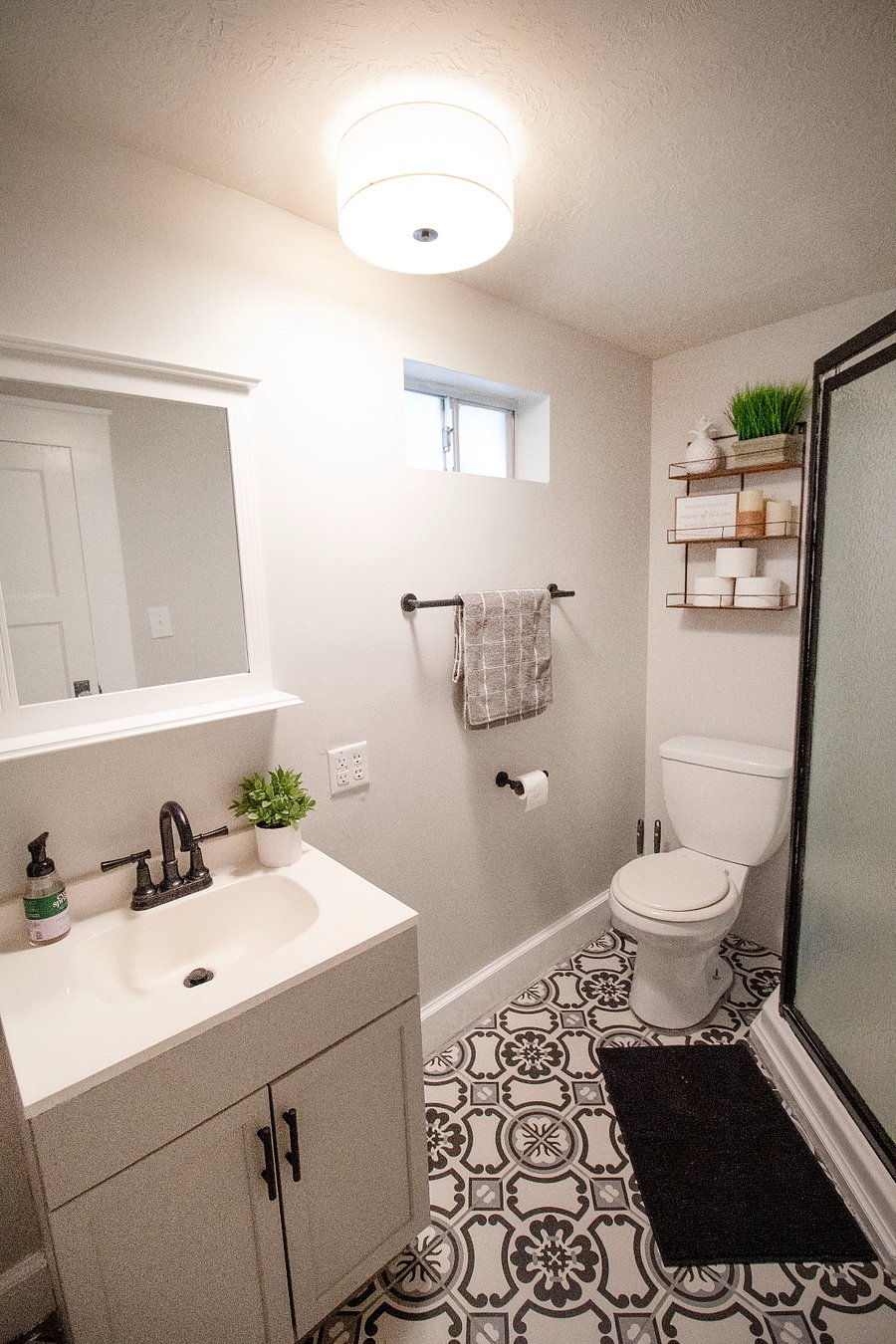 Bathroom off of the living room with walk in shower