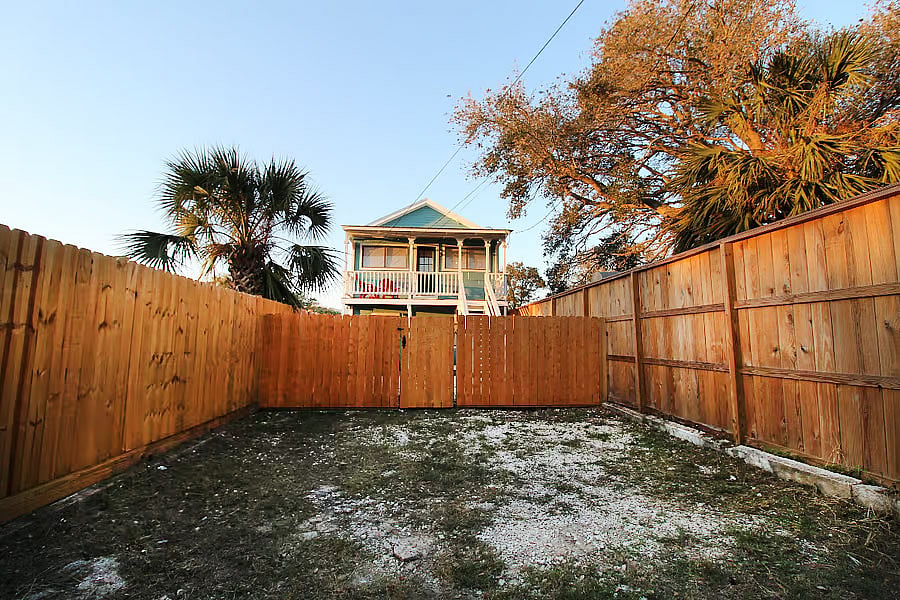 Off street parking in the back of the house. Leads to the gated backyard.