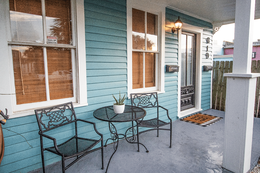 Bright, inviting porch with seating and a secure private entrance, just a short walk to the beach and UTMB.