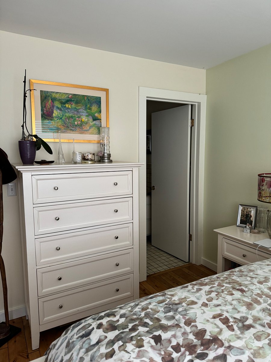 Dresser and entrance to bathroom