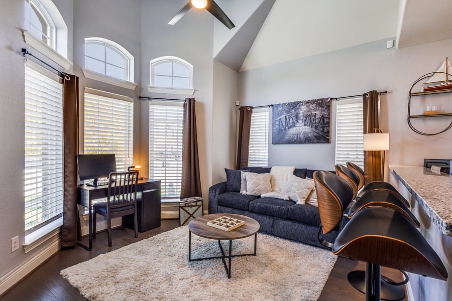 Private living room with 13 foot high ceiling, wood floor, ceiling fan, coffee table, books, and Queen sofa pull out bed with memory foam (sleeps 2). Large 50 inch HD Roku Smart TV, sound bar & subwoofer. Entertainment console & family board games.