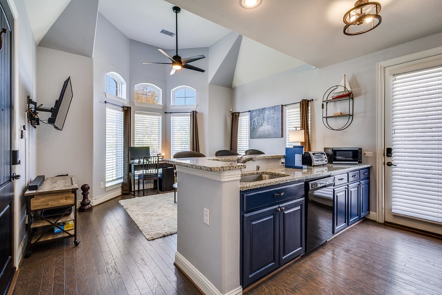 Full kitchen with granite counter tops, stainless steel farmhouse sink, dishwasher, microwave, Keurig coffee maker, toaster oven.