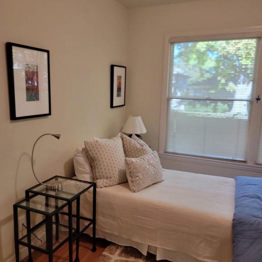 Two windows. dresser, table desk. Trundle bed.