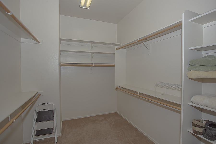 Primary bedroom walk in closet