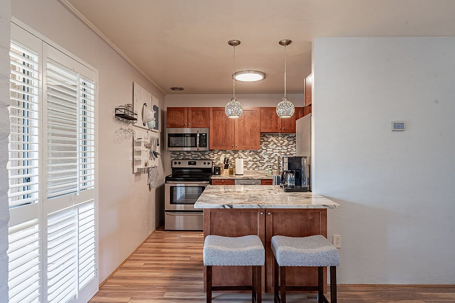 Kitchen counter bar with bar stools.