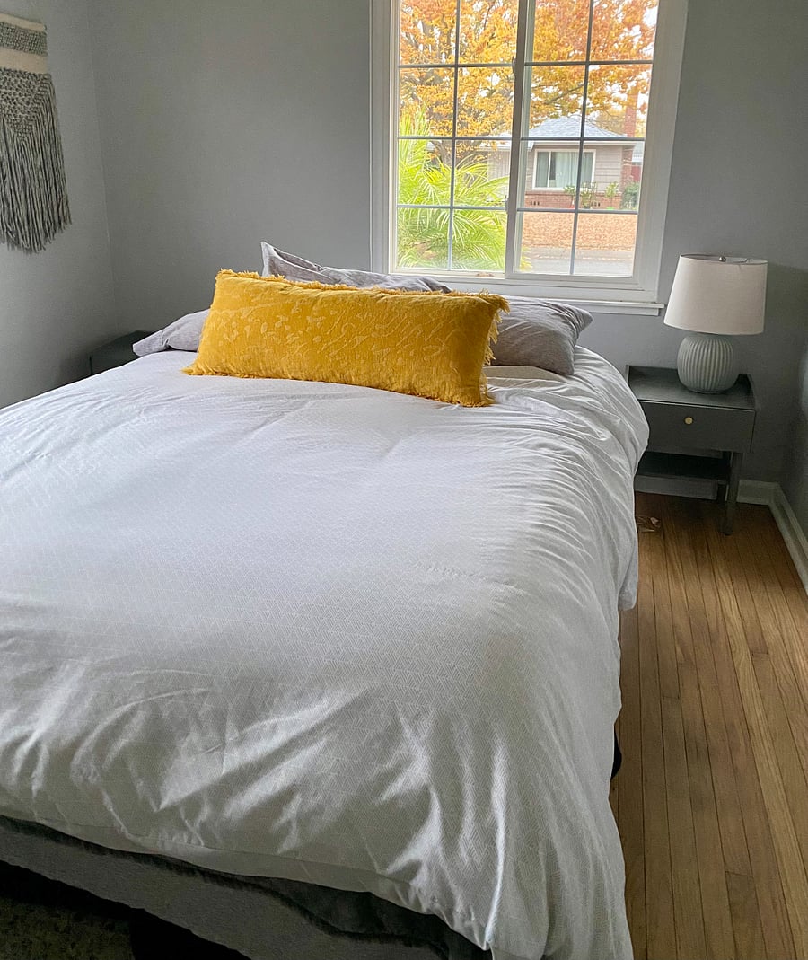 Tenant room: two nightstands with a lamp. There are 2 power strips on each side of the bed.