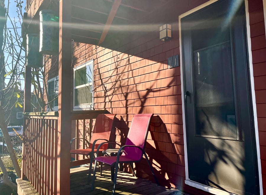 Back patio has delightful morning light. I loved to sit here and enjoy a cup of coffee. The community garden space, which you can participate in and harvest from is right next to the patio
