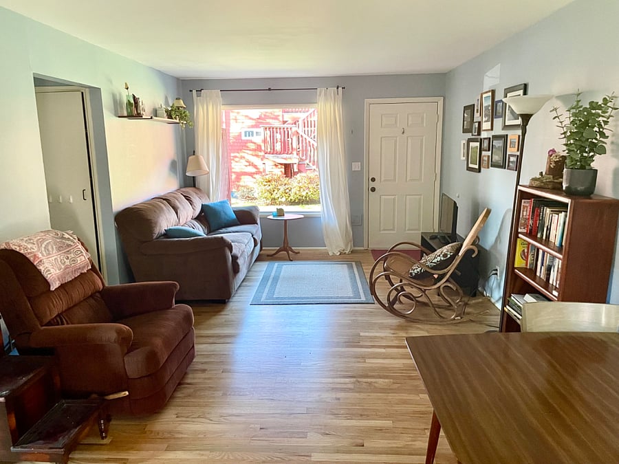 Living room has a large picture window, comfy couch, recliner, rocking chair, new smart TV, and a variety of books, games, and puzzles for you to borrow. New smart TV is bigger and not in the picture yet