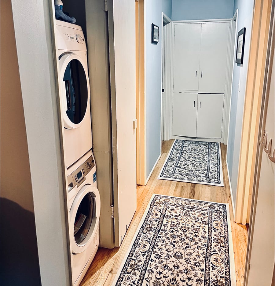 Hallway has 3 closets, one is just to the right outside the picture. Washing machine is a front load energy star machine, dryer is on top.