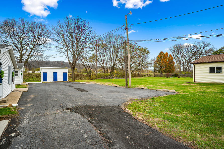 Parking lot area has pole lighting and plenty of grass area for walking dogs and exercise.