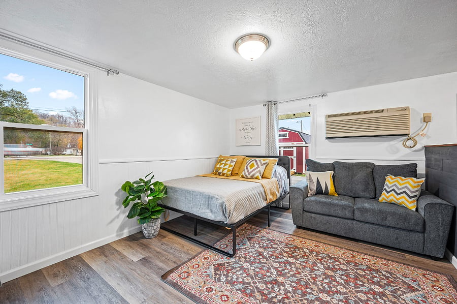 Full size bed and new sofa with linens provided.