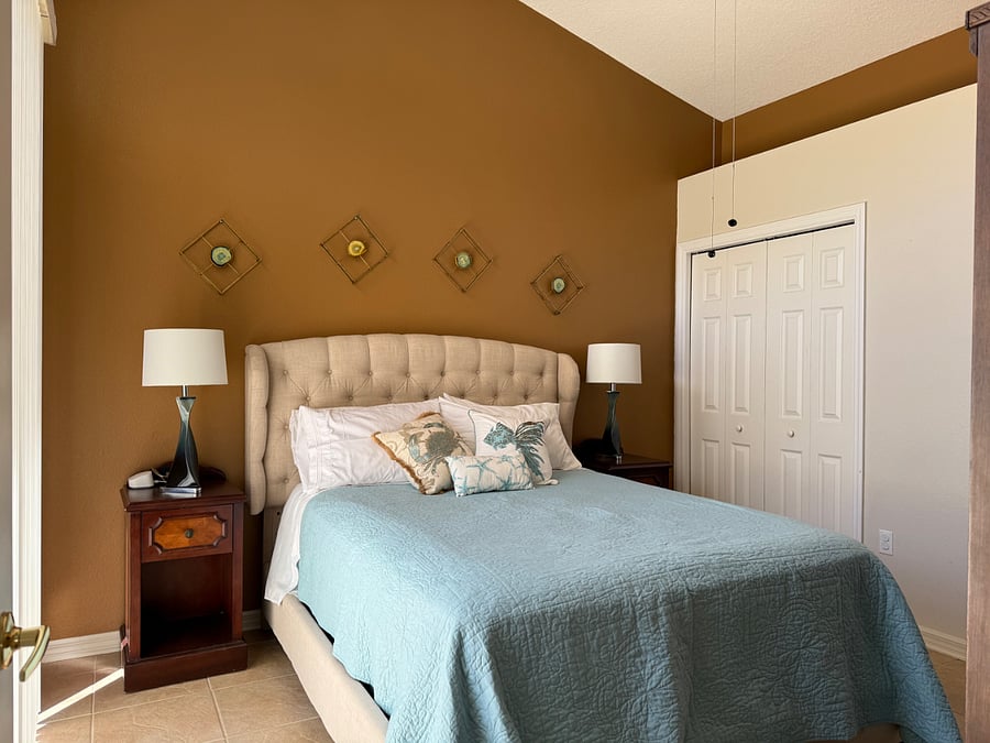 Second bedroom with queen bed, closet and storage.