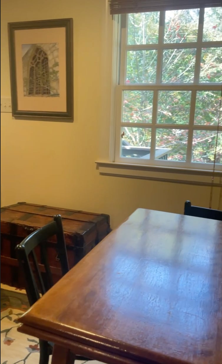 Living area with pull-out leaf table seats up to four