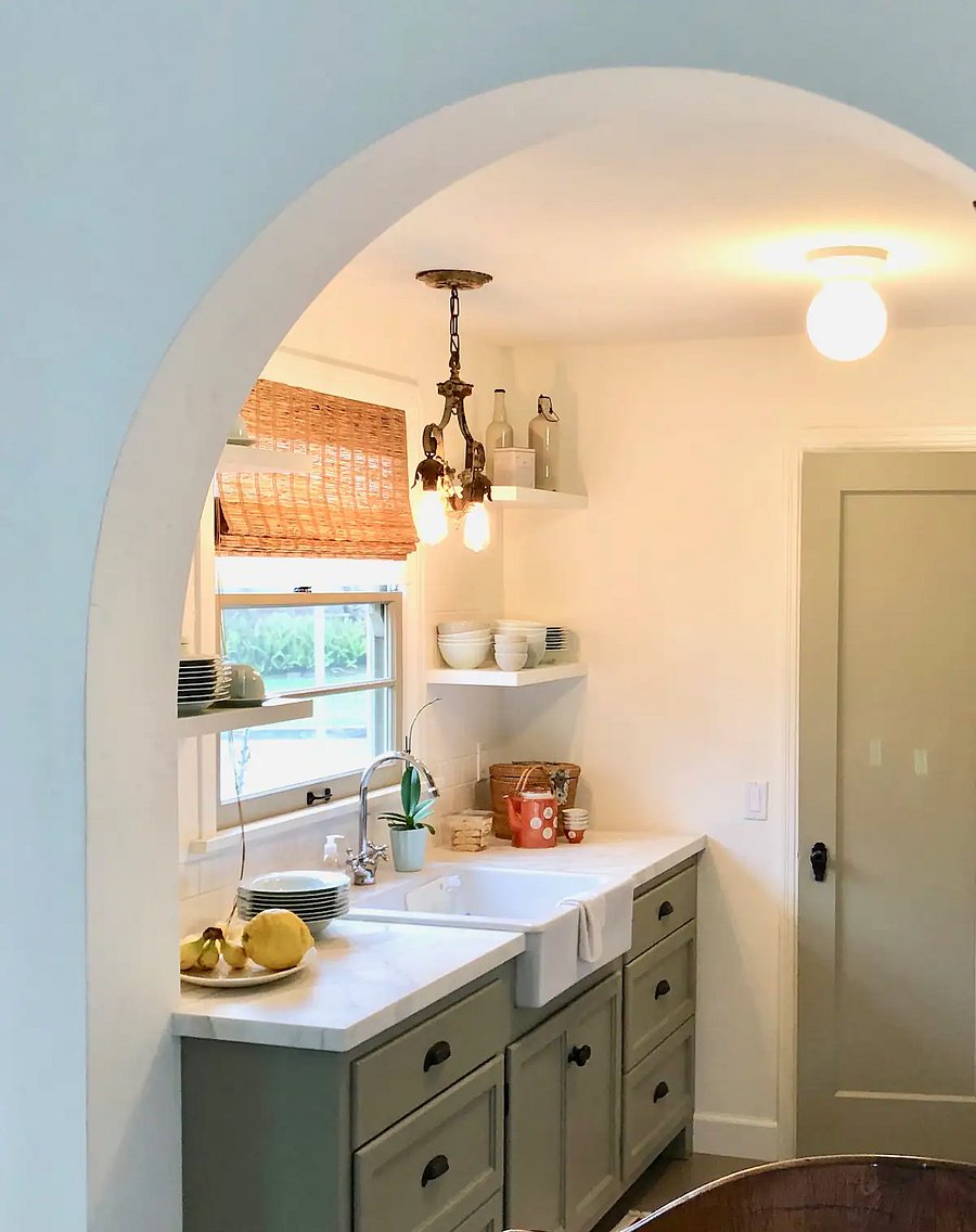 Kitchen farm sink counter with window giving to the fruit garden outside.