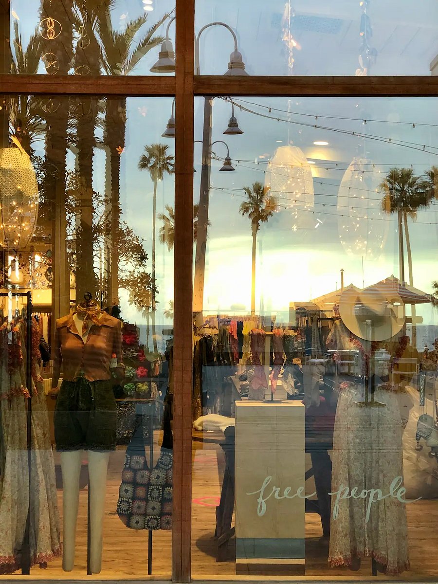 Shop in trendy boutiques at Pacific City outdoor mall with views of the Pacific Ocean.
