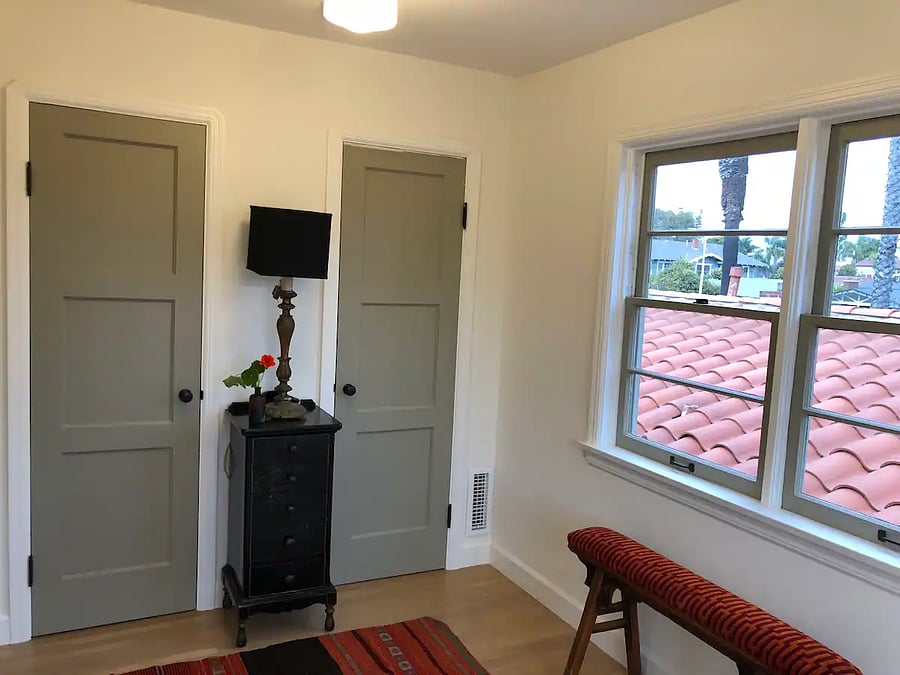 Upper mother in law quarters Bedroom 3 with (2) storage closets and large windows facing Main St.
