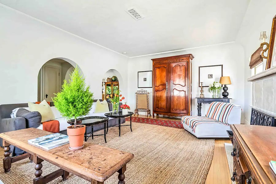 Main house - Living room with a view of architectural arches leading to the Dining room.
