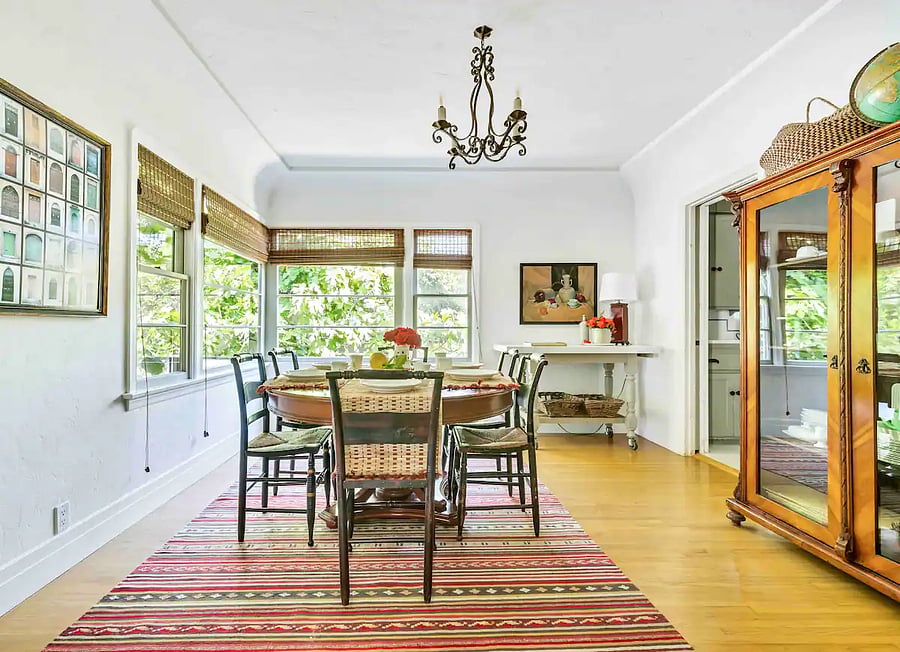 Formal Dining room (seating 6 to 8) with large corner windows that let in morning sunlight and breezes, in the main house.