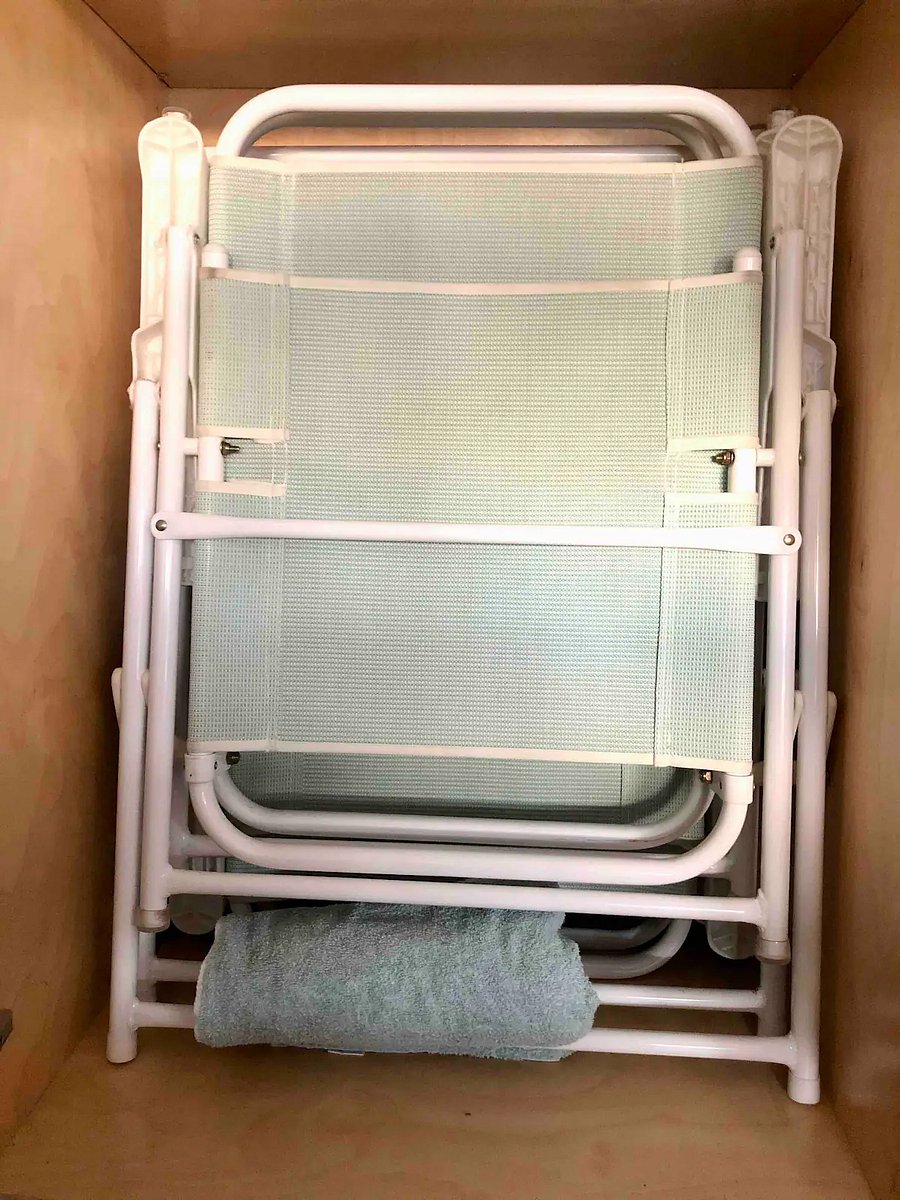 8 Beach chairs stored in the garage cabinets.