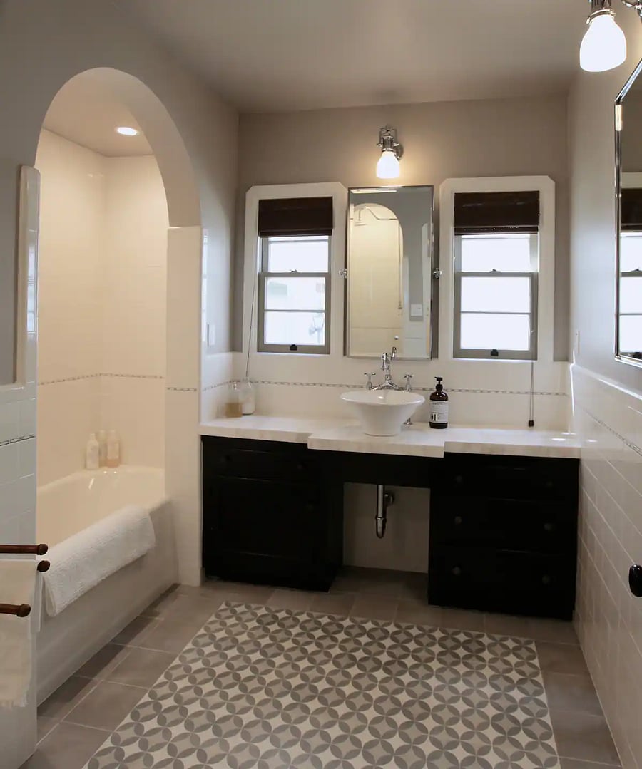 Spacious Master Bathroom with Calacatta stone countertop in main house