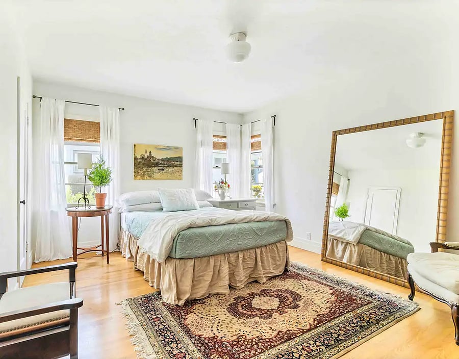 Master/bedroom suite 2 with a queen bed and ensuite bath - in main house .