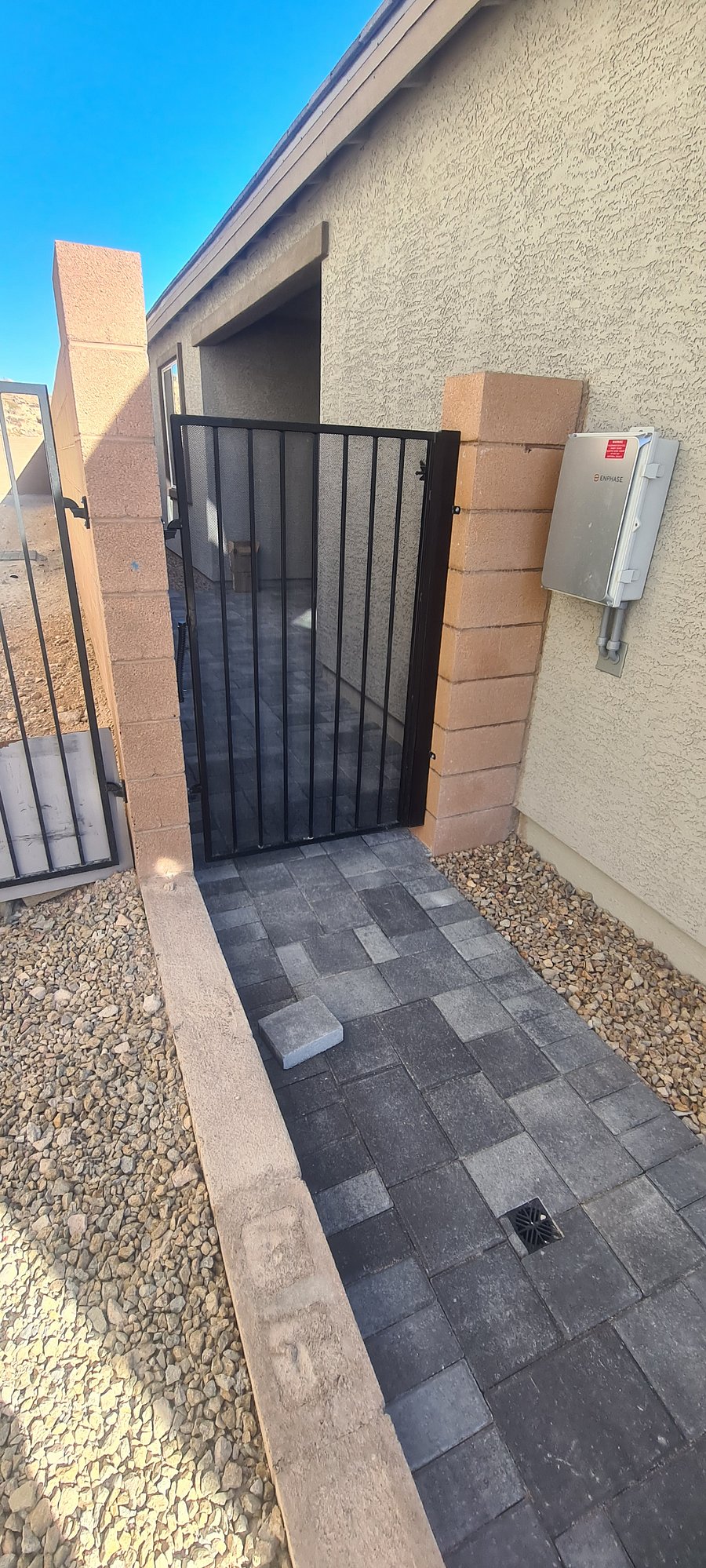 Exterior evening lighting by gate entrance