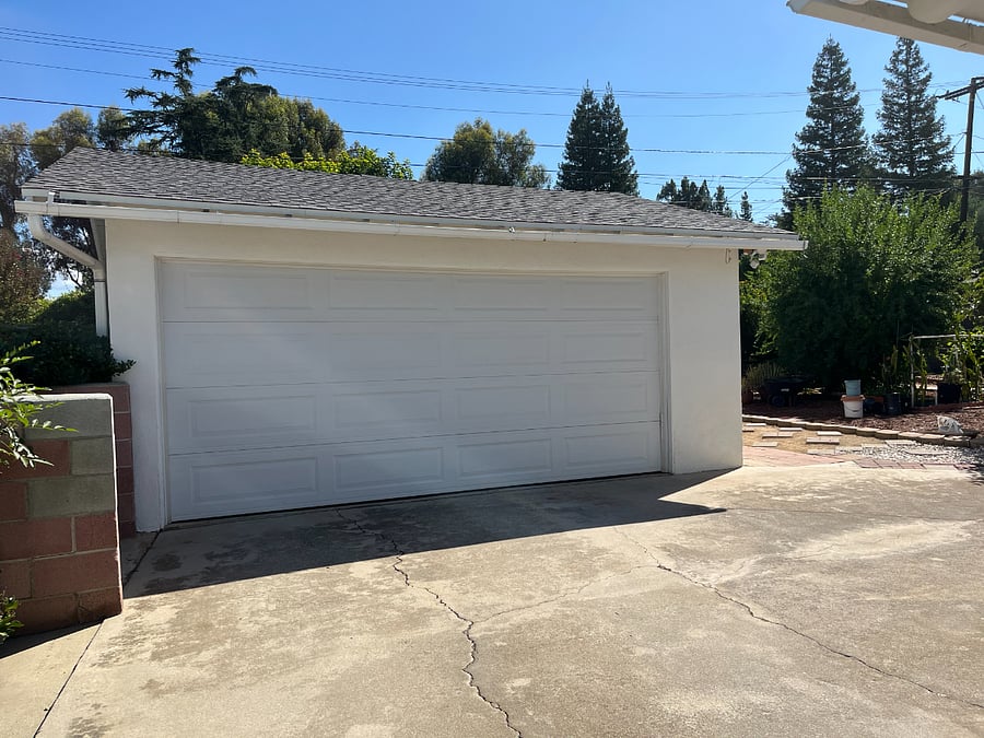 shared 1 car space in a detached 2-car garage with remote control