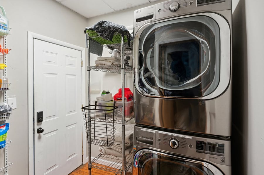 This laundry room is about 15 feet away from the front entrance to the unit. It is shared with two other units in the building.