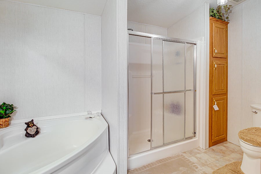 Master Bathroom has a shower and garden tub combo.