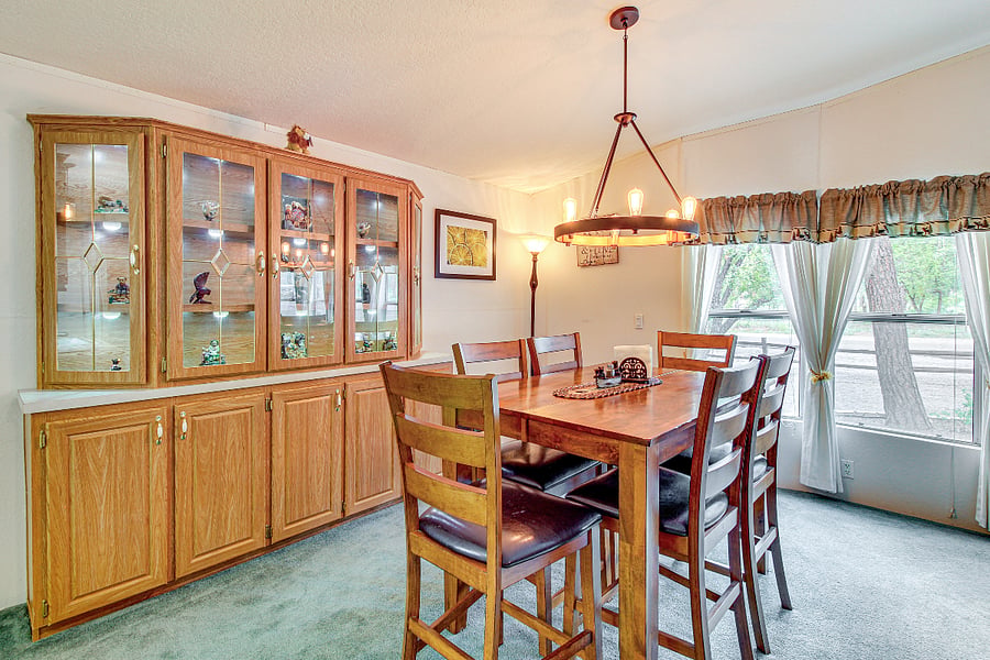 Dining room with access to the front open window area.  Perfect for meals while being able to see the relaxing out door wild life.