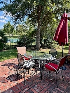 Shared backyard patio with lake view.