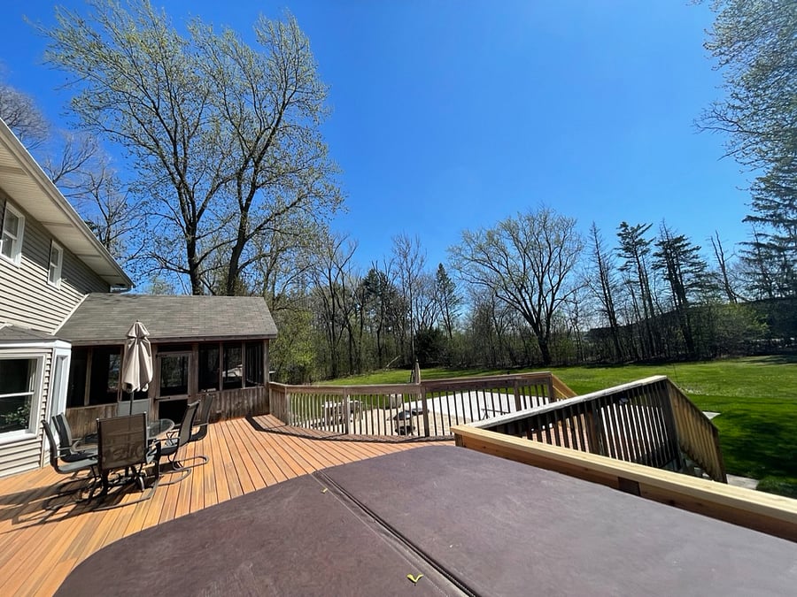 Sunroom opens to back deck.