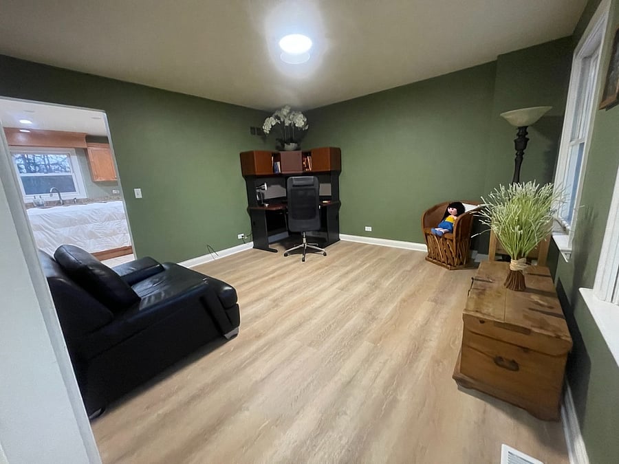 First floor office/living room includes desk and chair. Work from home.
