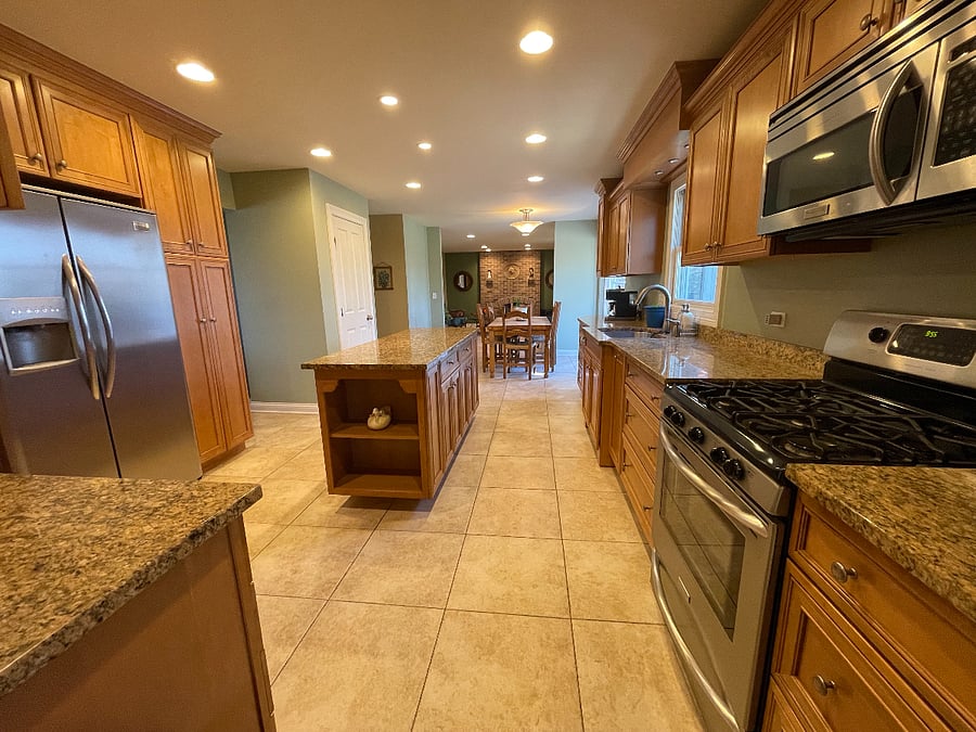 Fully stocked kitchen with island.