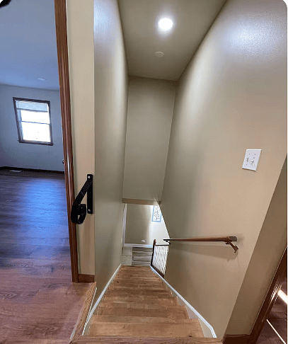 Second floor top of stairs going to first floor.