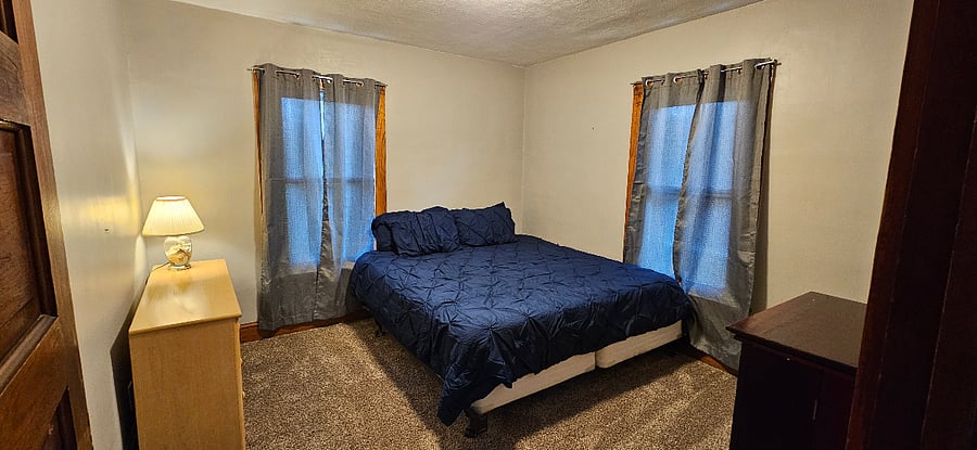 Blue bedroom with king bed