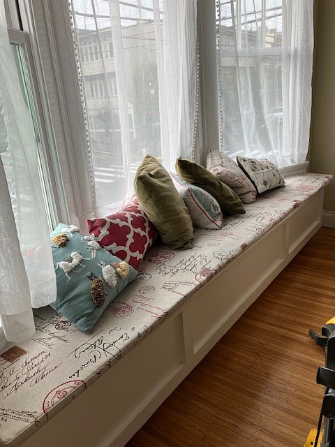 Charming LR window seat, one of 3 sets of bay windows in unit