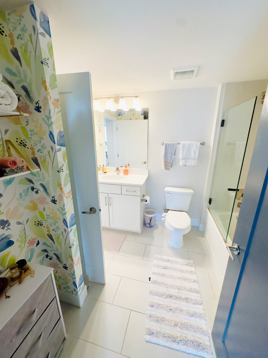 Large bathroom with soaking tub and rain shower