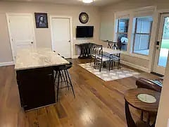 Kitchen / living room area with smart TV can be adjusted by moving the sofa and table as desired. Floors are faux wood composite - very durable and easy to clean.