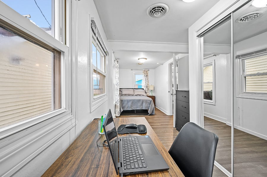 Room #2 with desk, bed , closet, dresser and plenty of space & light. Has a private entrance.