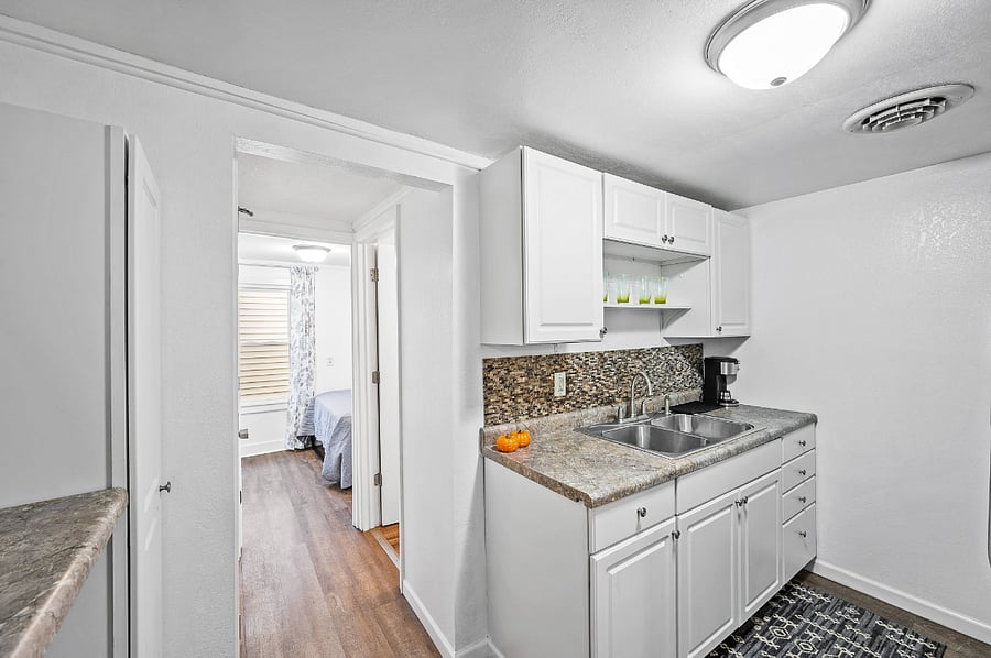 Kitchen and hallways to bathroom and bedroom #2